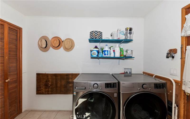 Laundry Room With Collapsible Folding Table And Side Door Access