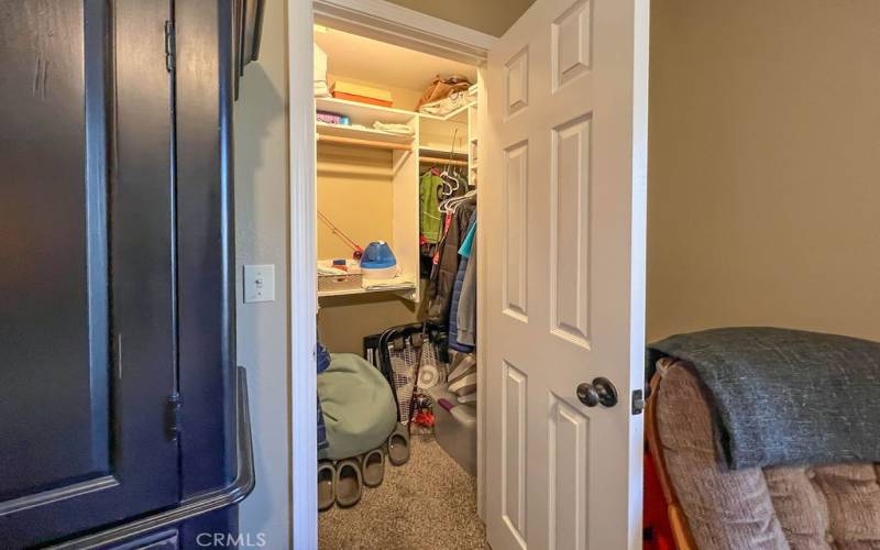 The spacious closet in the front bedroom accommodates clothing and extras.