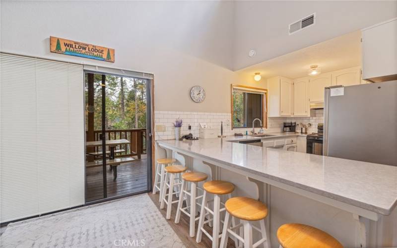 updated kitchen, leads to back deck