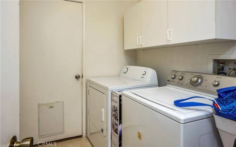 Laundry sits between hall and garage and has a generous pantry.