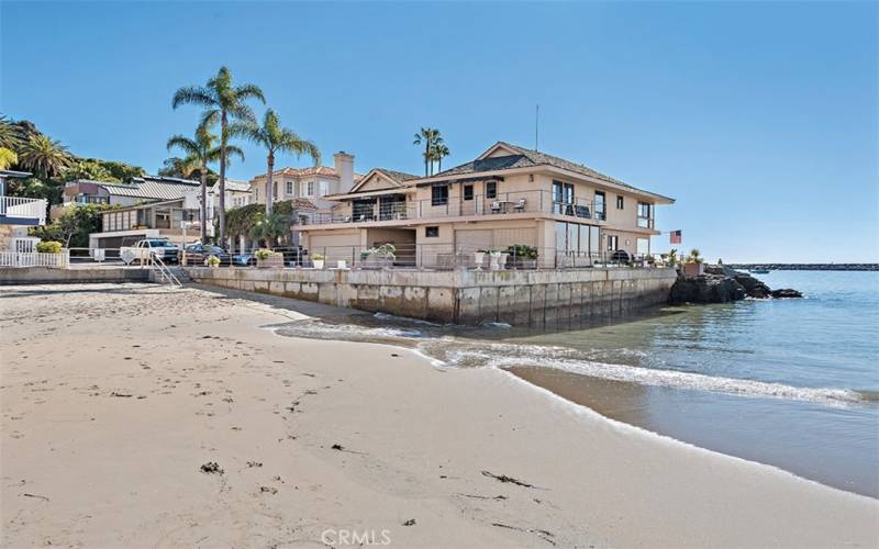 The property is nearly surrounded by beach or water, depending on the level of the tide