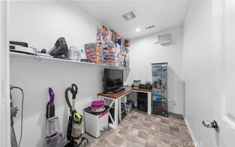 Originally the laundry room inside, the sellers converted the room into an extra large storage room (or pantry) or could be converted back
