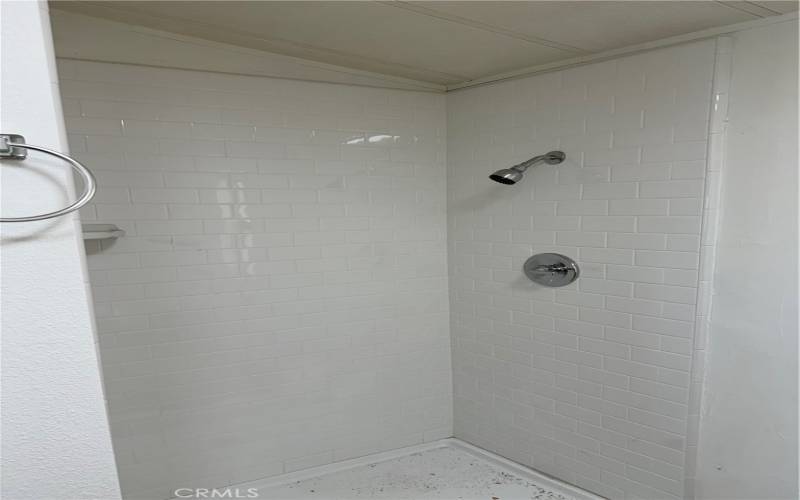 Primary Bathroom has hand laid subway tile