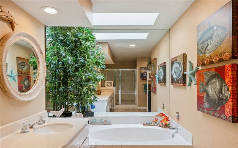 Relax in this separate tub and plenty of light with the skylight above