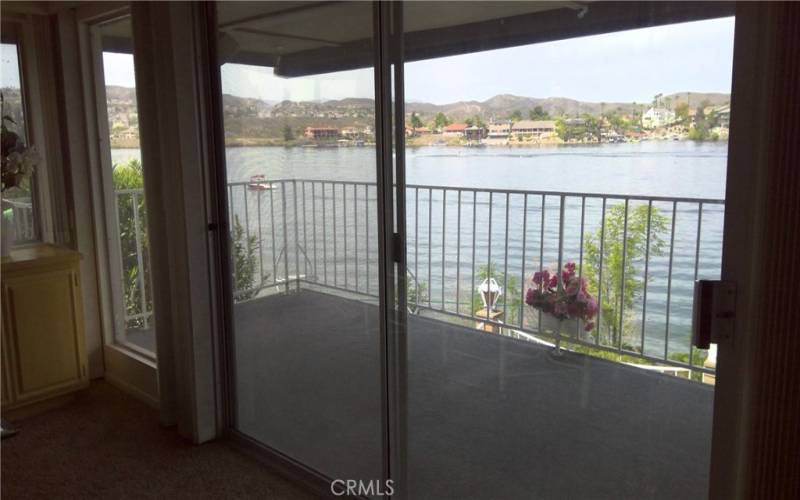 UNOBSTRUCTED LAKE VIEW FROM LIVING ROOM PLUS PRIVATE DECK.