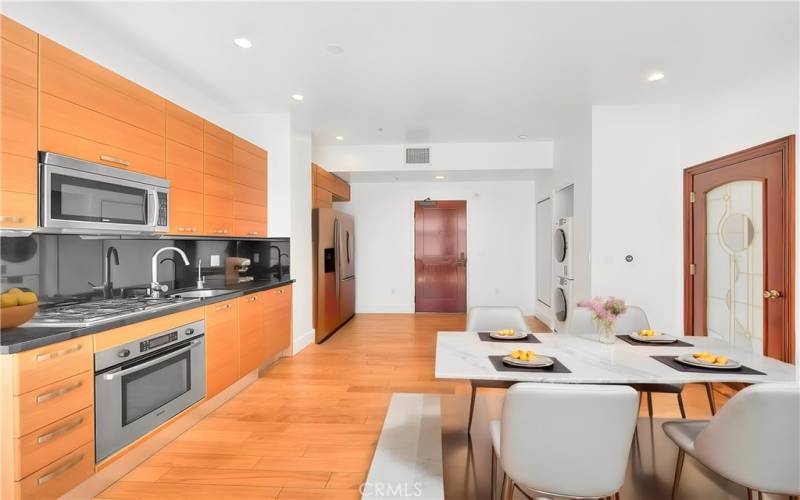 Dining area and kitchen, virtually staged to demonstrate potential