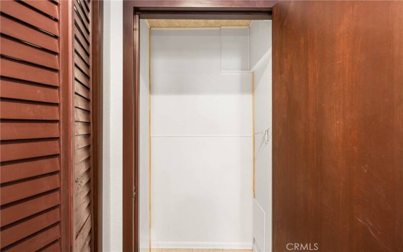 Upstairs hallway closet has been designed to provide an optional or additional laundry area.