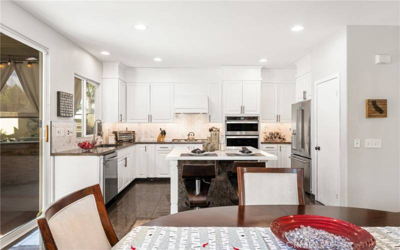 This kitchen is a chef's delight with newer stainless appliances and pantry.
