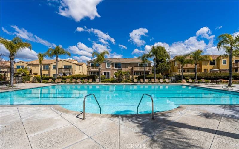 Community pool offers plenty of space for swimming or lounging.