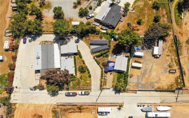 Aerial view of property. Lots of paved gated space, as well as a gated secure storage yard.