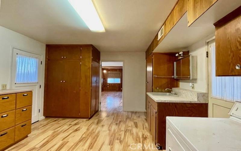 Laundry room, accessible from carport, kitchen and primary bedroom