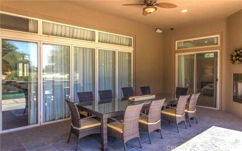 Dining area off the patio with fireplace