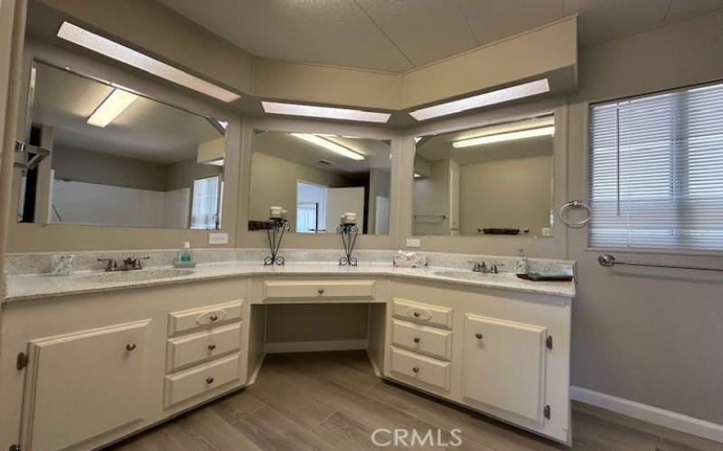 Master bathroom with a vanity and double sinks.