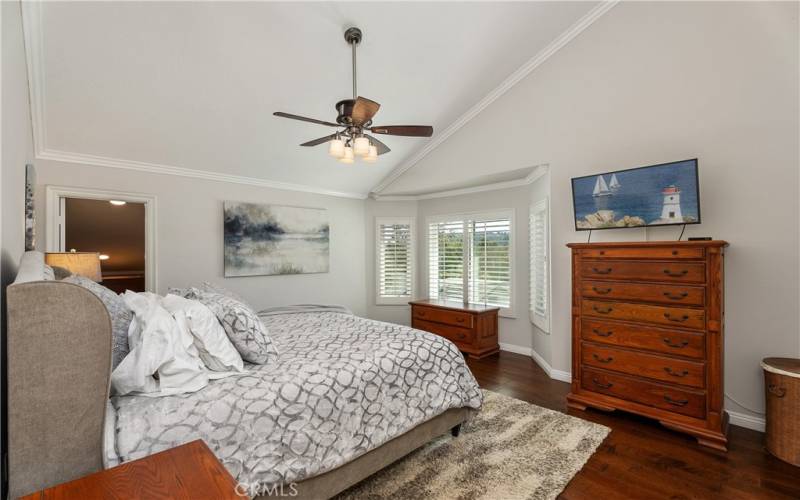 Upstairs primary bedroom with vaulted ceilings and views of Laguna Niguel.