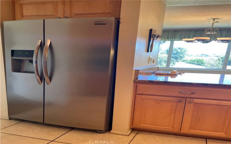 Large refrigerator with ice maker.
