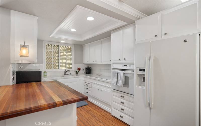 Kitchen opened up with breakfast peninsula, recessed lighting, newer cabinetry...
