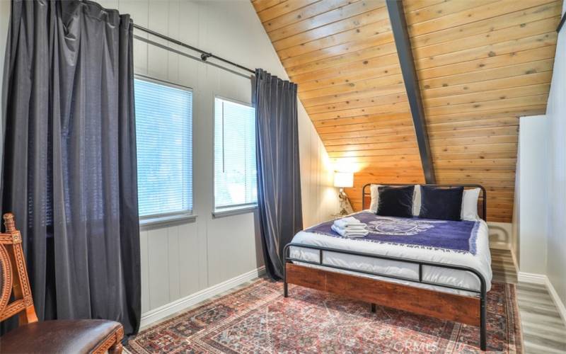 Bedroom 1: Loft with cathedral ceilings