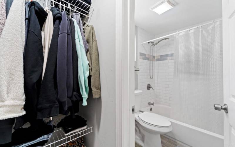 The closet connects the open area to the bathroom.