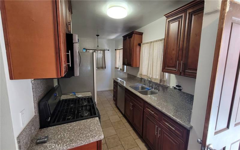 The downstairs unit has been updated with granite counter tops, new cabinets, stainless steel appliances, etc.