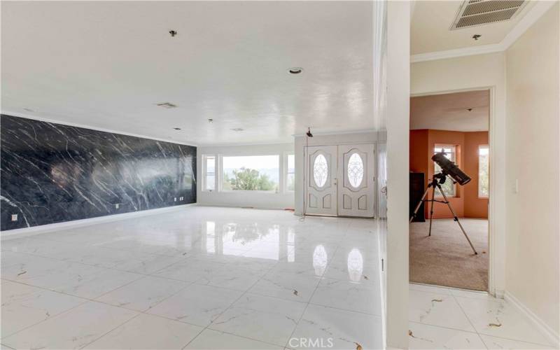 Living Room with new Tiled Floors & Venetians paint on the walls