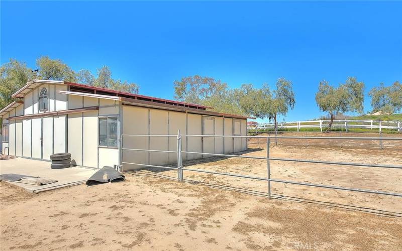 4 stall barn with tack room and turnout area.