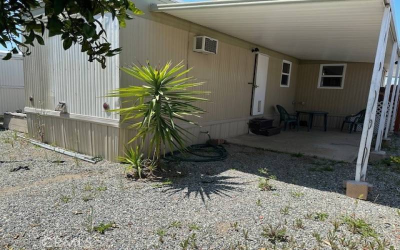 Backyard facing back patio.