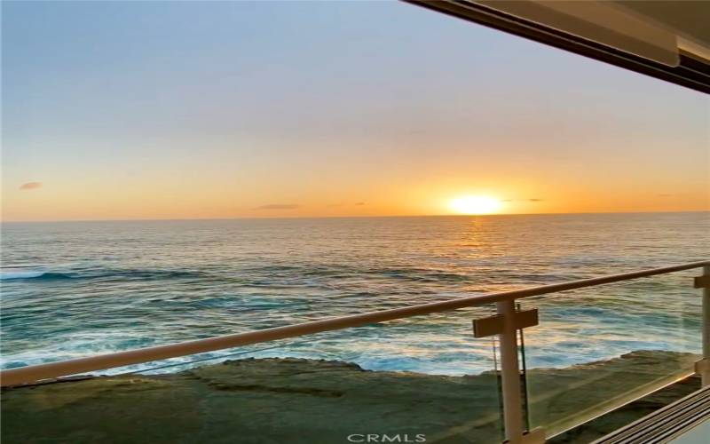 Main bedroom with sunset views over the ocean