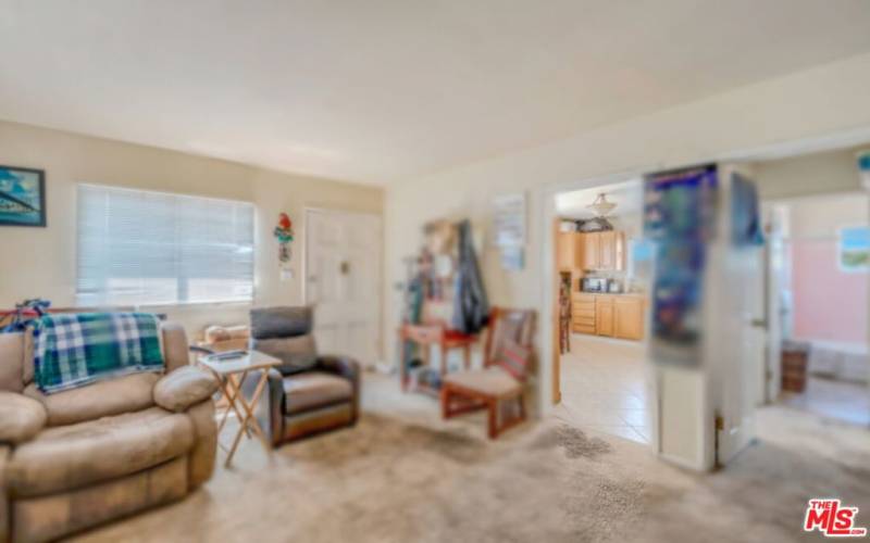 view to large kitchen from living room