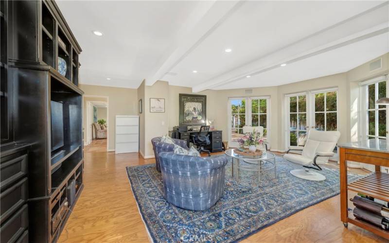 A large family room connecting to the backyard creating an ideal space for entertainment and casual gatherings.