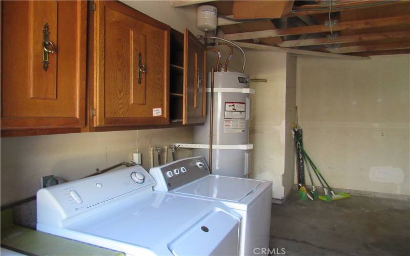 Washer and dryer in garage, lots of cabinets