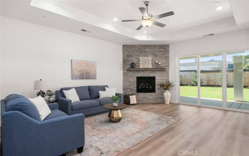 Large open floor plan with floor to ceiling stone fireplaces