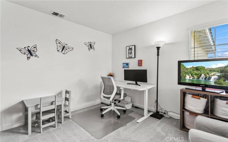 This designated office space is the perfect place to work from home or convert it into another bedroom.