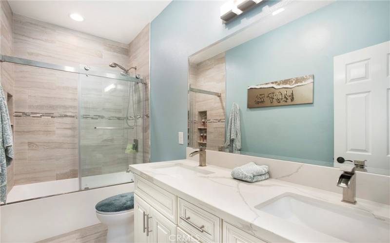 Upstairs remodeled baths to compliment the secondary bedrooms.