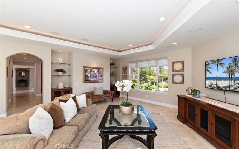 Spacious family room with a wet bar and views from the front to the back of the home.