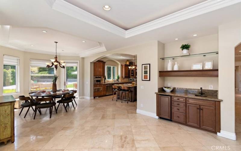 Great home for entertaining with wet bar, coffee bar, and kitchen that flows to the outside