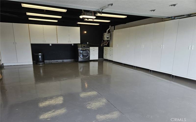 painted garage with epoxy and cabinets