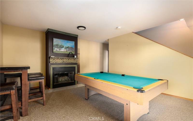 Game room with fireplace lower level