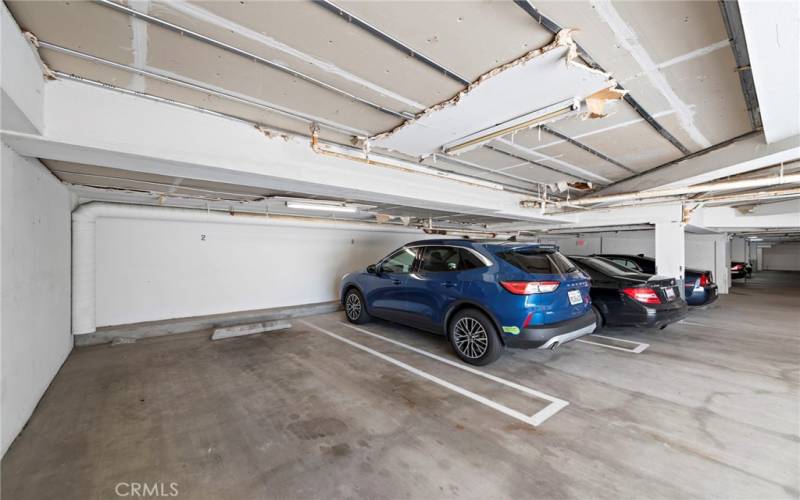 Covered parking in shared garage. Unit 2 has 2 parking spaces