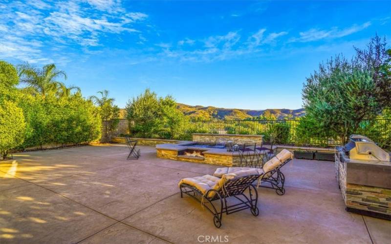 Spacious patio with elevated jacuzzi spa with two gas firepits