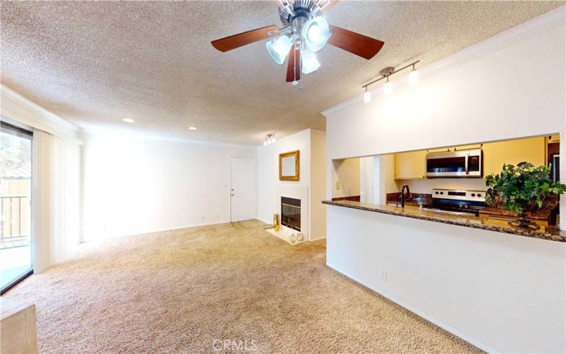 Pass through kitchen with bar height counter and pass through to dining room.
