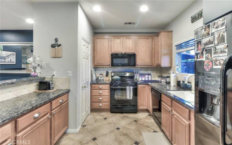 Kitchen with granite countertops and tile backsplash