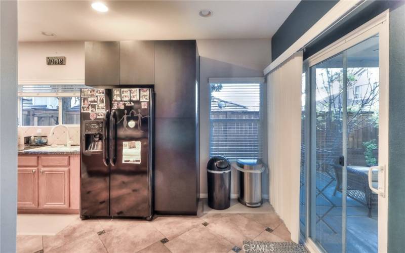 Kitchen with granite countertops and tile backsplash