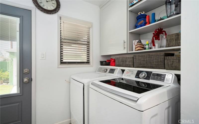 An interior laundry room off the kitchen adds convenience to everyday chores.