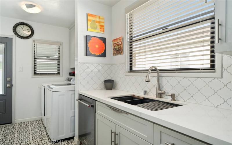 An interior laundry room off the kitchen adds convenience to everyday chores.