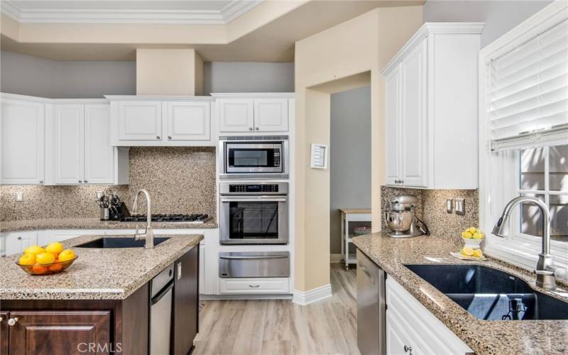 Everything you need…including dual dishwashers, a double wide SubZero, built in wall oven, microwave and warming drawer, trash compactor and a gas Viking stovetop. A prep sink and large kitchen sink that has a window looking out over the back yard.