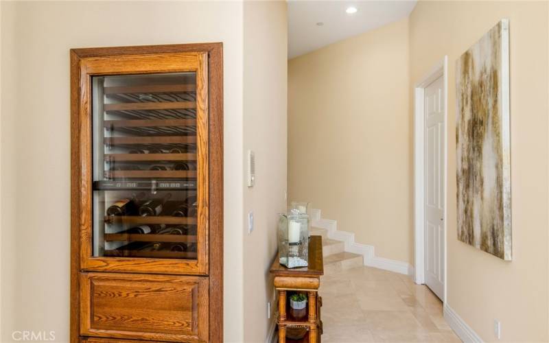 Past the breakfast nook to the formal dining room, there is a built in wine fridge and refrigerator drawers. Very convenient.