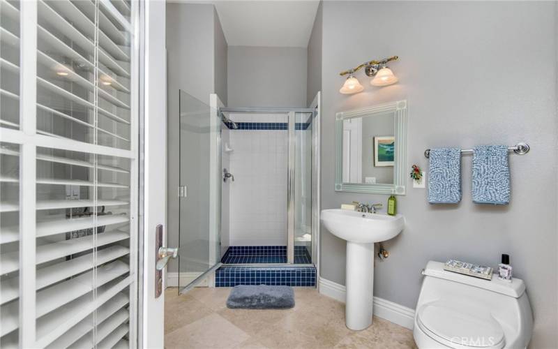 There is a 3/4 bathroom with a door to the backyard that is great for use with your pool guests. It leads to the craft room.