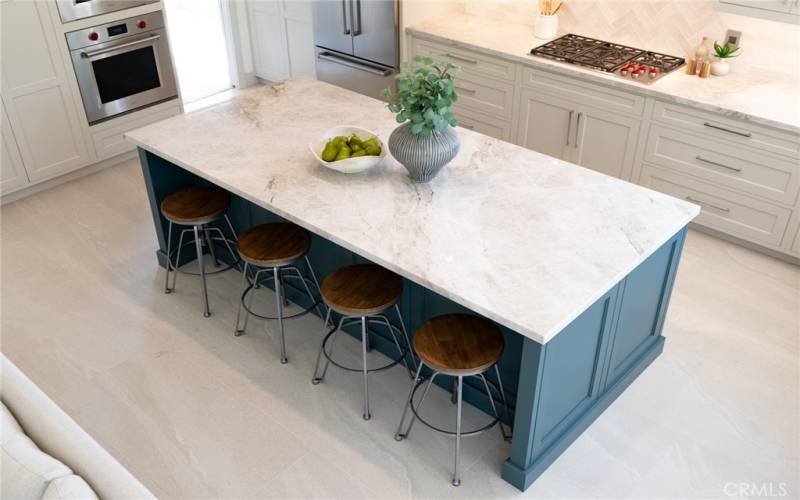 The kitchen island is substantial. In addition to all the storage there is a comfortable bar area for causal eating.