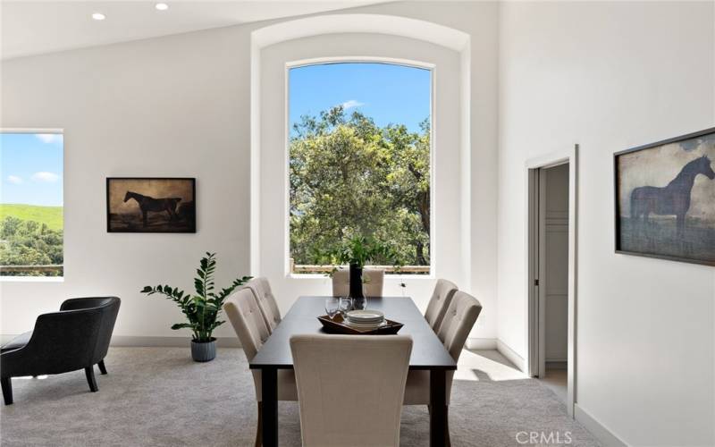 Perfectly framed view from the grand window in the formal dining area. There is a pocket door between the kitchen and formal dining area if you desire a separation while hosting.