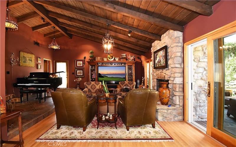 Family room with fireplace and access to outdoor patio area